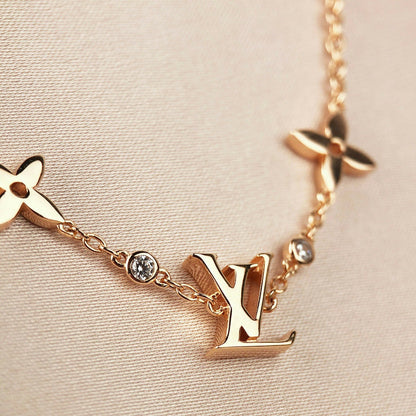 [Elara]ARMBAND "STAR AND SUN 7 MOTIFS" AUS GOLD