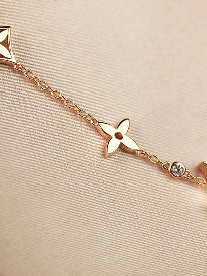 [Elara]ARMBAND "STAR AND SUN 7 MOTIFS" AUS GOLD
