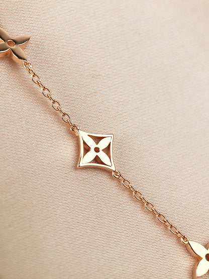 [Elara]ARMBAND "STAR AND SUN 7 MOTIFS" AUS GOLD