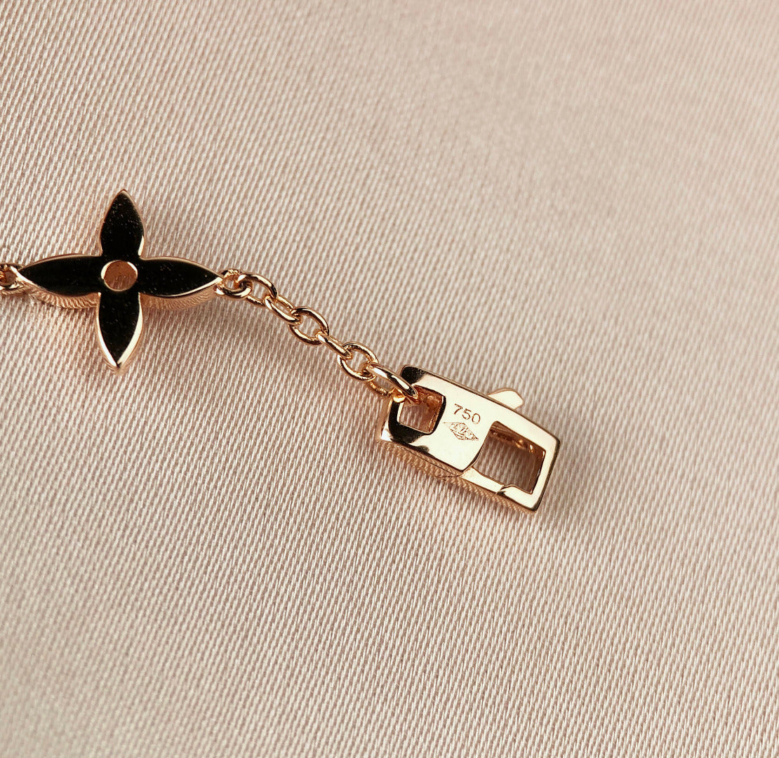 [Elara]ARMBAND "STAR AND SUN 7 MOTIFS" AUS GOLD