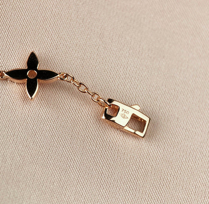 [Elara]ARMBAND "STAR AND SUN 7 MOTIFS" AUS GOLD