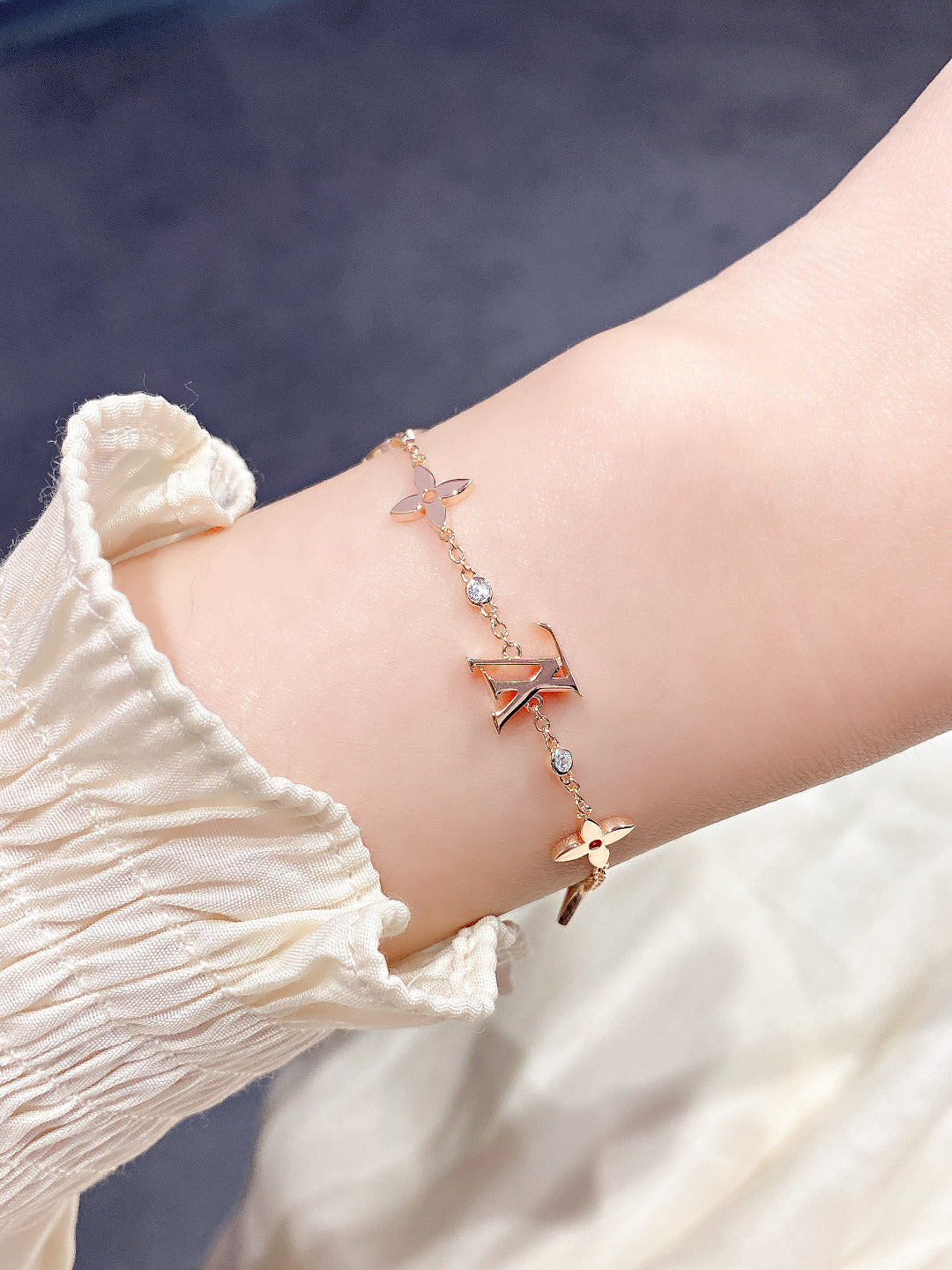 [Elara]ARMBAND "STAR AND SUN 7 MOTIFS" AUS GOLD
