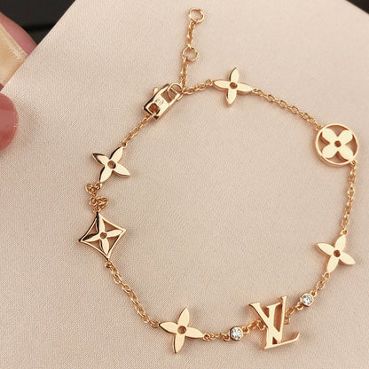 [Elara]ARMBAND "STAR AND SUN 7 MOTIFS" AUS GOLD