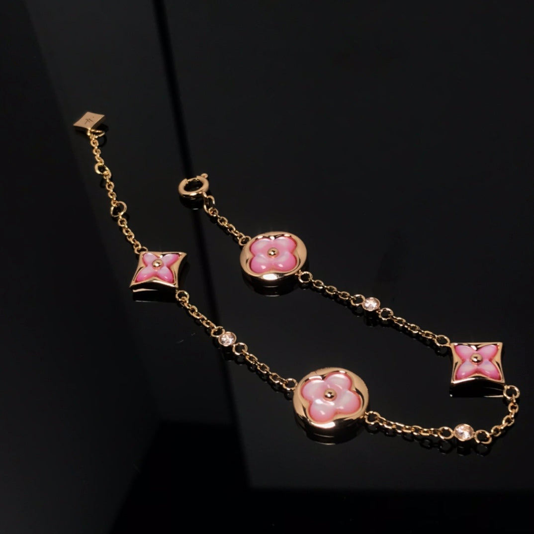 [Elara]STAR AND SUN 4 MOTIV ROSA PERLMUTT ROSÉGOLD-ARMBAND