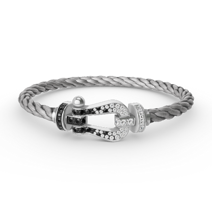 [Elara]GROSSES HUFEISEN ARMBAND AUS SCHWARZEN UND WEISSEN DIAMANTEN - WEISSGOLD