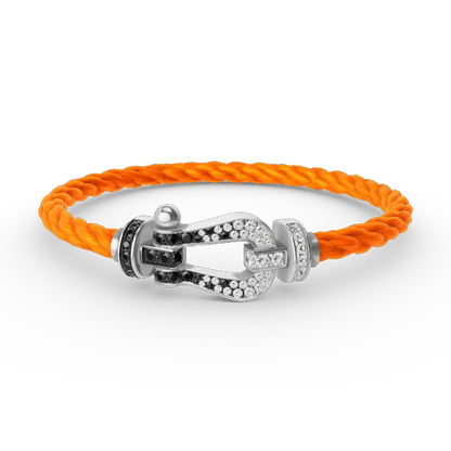 [Elara]GROSSES HUFEISEN ARMBAND AUS SCHWARZEN UND WEISSEN DIAMANTEN - WEISSGOLD